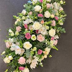 Casket spray in pinks and whites