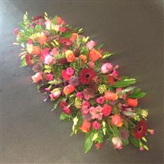 Casket spray in autumn brights