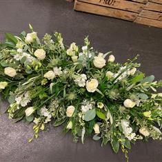 Casket spray in whites and creams