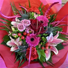Valentine's hand tied bouquet in vase