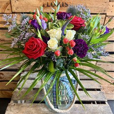 Heather hand tied bouquet in vase
